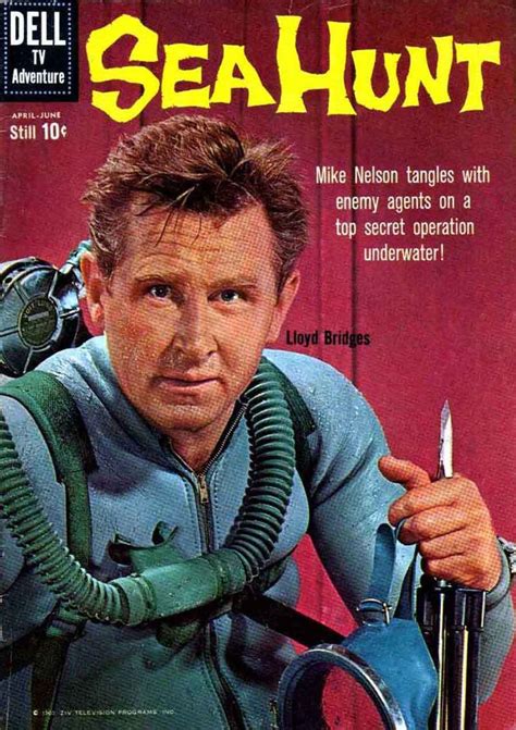 a magazine cover with a man in scuba gear holding a diving device and looking at the camera
