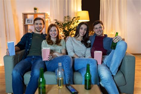 Friends With Beer And Popcorn Watching Tv At Home Stock Image Image