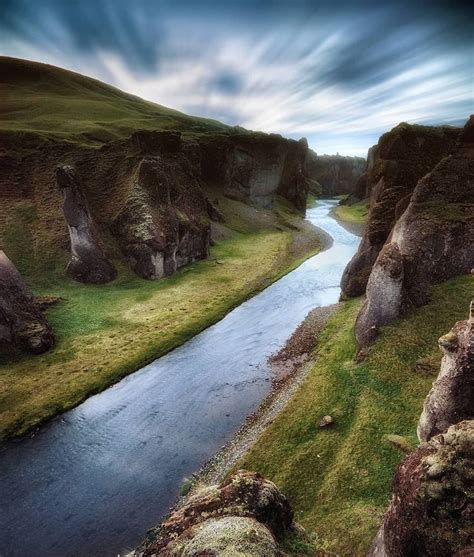 The Fjaðrá River Runs Through The Magnificent Fjaðrárgljúfur Canyon In