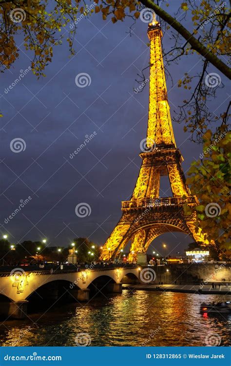 Eiffel Tower Illuminated At Dusk The Eiffel Tower Is One Of The Most