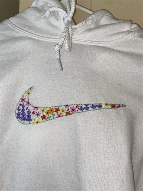 Custom Embroidered Hoodie With A Flower Filled Nike Logo As You Can