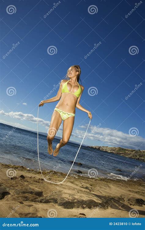 Woman Jumping Rope On Beach Stock Photo Image Of Fitness Play 2423810