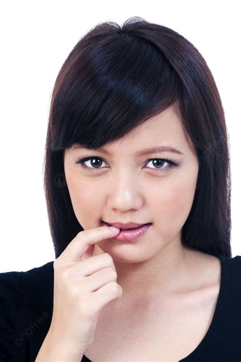 Portrait Of A Beautiful Young Asian Woman Biting Her Finger Photo