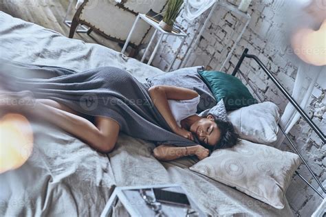 Peaceful Sleep Top View Of Attractive Young Woman Covered With Blanket