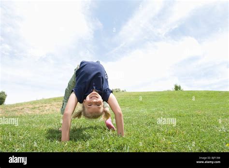 Bending Over Backwards Girl On Grass Stock Photo Alamy