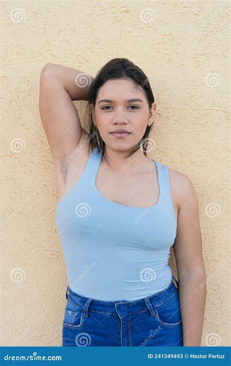 hispanic woman with unshaven armpits confidently looking at the camera stock image image of