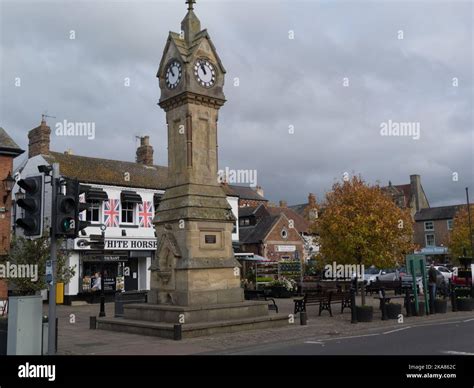 Clock Tower In Centre Of Thirsk Town Market Place With White Horse