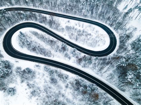 Curvy Winding Road Trough Forest At Winter Season Aerial Drone Top