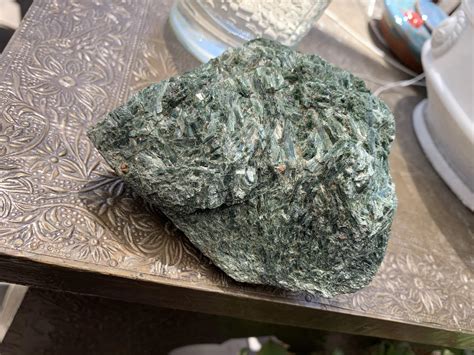 What Is This Rock Its Green Sparkles A Little In The Light And