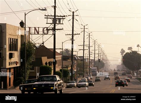 A Los Angeles Street Lined With Cars And Electric Power Lines