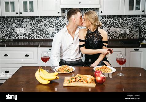 Lovely Couple Kissing After Evening At The Kitchen Stock Photo Alamy