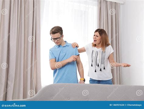 Mother Scolding Her Teenager Son Stock Photo Image Of Portrait