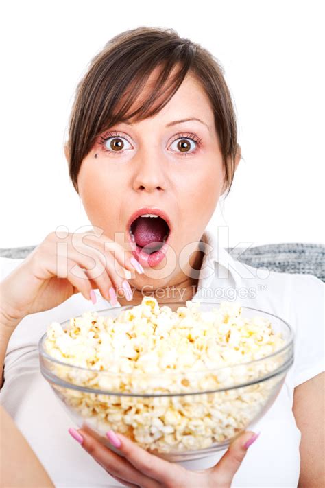 Young Woman Eating Popcorn Stock Photo Royalty Free Freeimages
