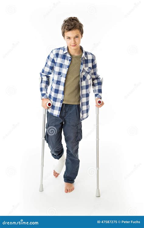 Teenage Boy With Crutches And A Bandage On His Right Leg Royalty Free