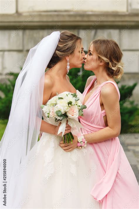 Bride And Bridesmaid Kissing At Wedding Day Happy Marriage And Wedding Party Concept Stock