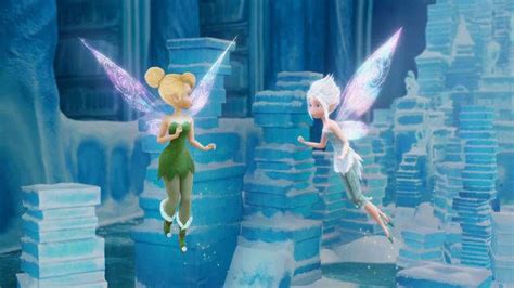 Two Tinkerbells Are Flying In The Air