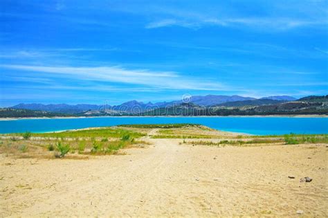 Beautiful Calm Blue Turquoise Mountain Swimming Lake Empty Sand Beach