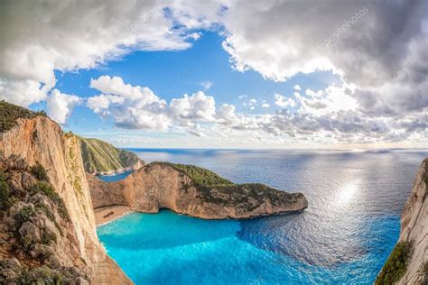 Navagio Beach With Shipwreck Against Sunset On Zakynthos Island In