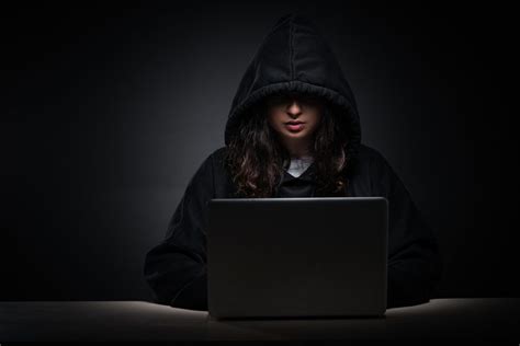 Female Hacker Hacking Security Firewall Late In Office Palmetto Payroll Solutions