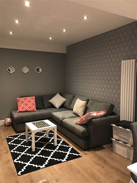 This spacious living room has plain gray walls with a white ceiling and window panels. Discover design inspiration from a variety of grey living room, including color, decor and ...