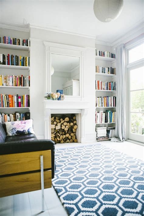 Home renovation ideas living room. Bookshelves in alcoves on either side of fireplace in ...