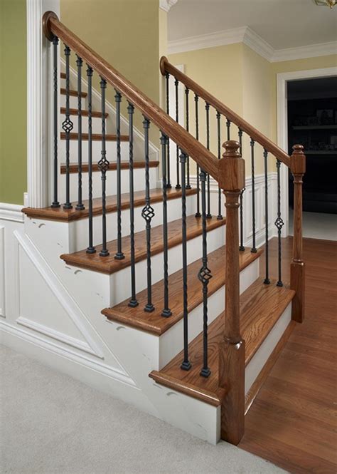 Beautiful wooden curved stairs | metal spindles with knuckle. Iron Stairways Systems | LJ Smith Stair Systems ...