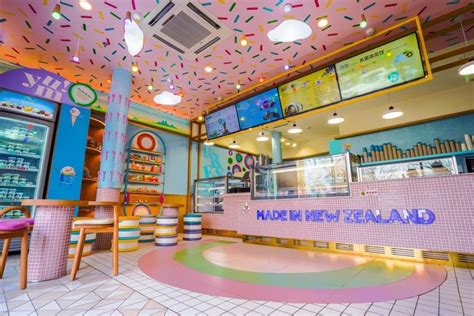 The Inside Of A Restaurant With Colorful Walls And Ceiling Tiles On The