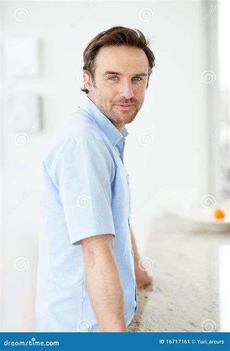Happy Young Man Standing By A Counter Indoor Stock Image Image Of