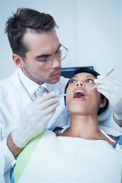 Male Dentist Examining Womans Teeth Stock Photo Image Of Adult