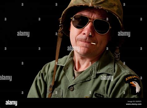 Portrait Of An American Soldier During The Vietnam War Period Wearing Dark Sunglasses And