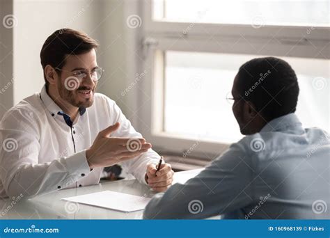 Friendly Hr Manager Holding Job Interview With Applicant Stock Image