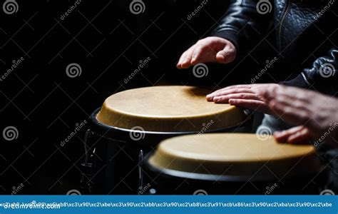 Drum Hands Of A Musician Playing On Bongs The Musician Plays The