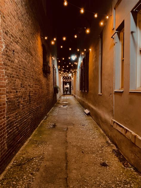 City Alley With Hanging Lights During Night Corridor Image Free Stock