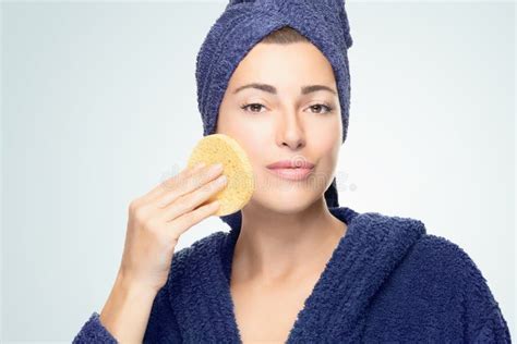 Healthy Skin Woman With A Cosmetic Sponge Cleaning Her Face Daily