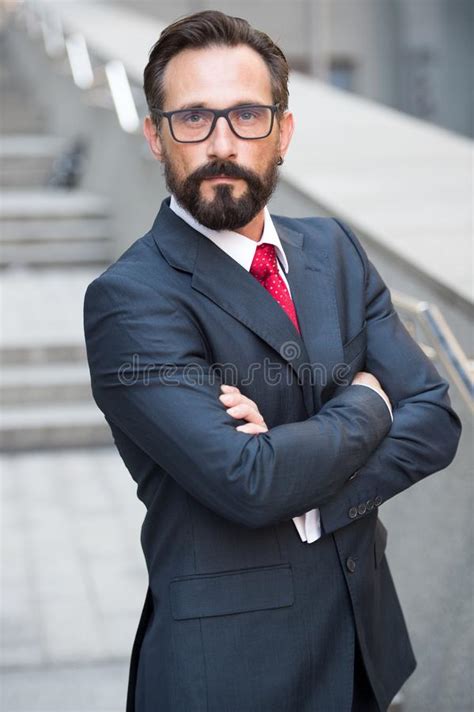Calm Bearded Manager Keeping Hands In Crossed Position Stock Image