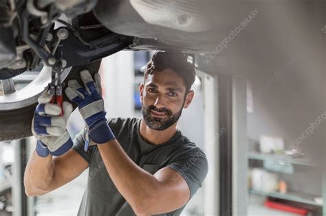 Portrait Auto Mechanic Working Under Car Stock Image F0211868