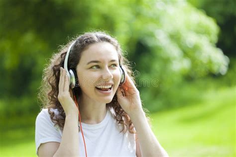Beautiful Young Woman Listening To Music In A Park Stock Image Image