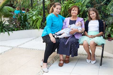 Great Grandmother With Adult Granddaughter And Great Granddaughters