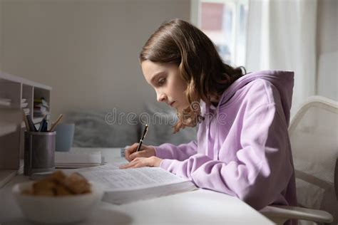 Smart Teen Girl Study With Textbook At Home Stock Photo Image Of