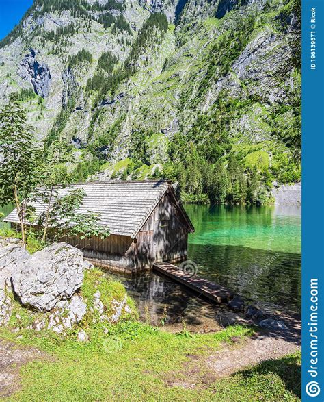 Lake Obersee With Rocks And Boathouse In The Berchtesgaden Alps
