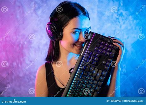 Portrait Of The Beautiful Young Pro Gamer Girl Standing With A Gaming