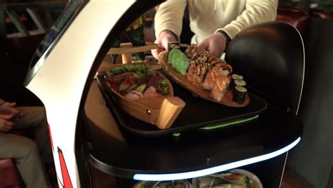Serviced By Robots This Futuristic All You Can Eat Restaurant Cooks