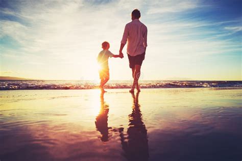 Father And Son Walking Together Holding Hands Stock Photo Image Of