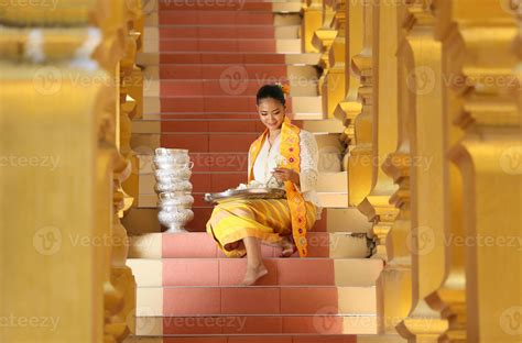 Young Asian Girl In Traditional Burmese Costume Holding Bowl Of Rice On