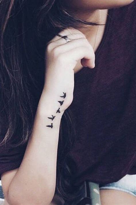 Cute Small Flying Bird Sparrow Silhouette Wrist Arm Tattoo Ideas For