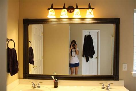 I decided to paint my mirror frame the same color as the bathroom vanity that i painted for an easy. Easy DIY mirror frame and lowes light fixture | Decorating ...