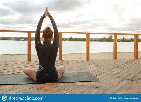 Nature Meditation Concept. Woman Do Yoga In Lotus Position Stock Photo ...