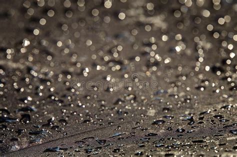 Abstract Dark Gray Background Blurred Raindrops With Bokeh On A Black