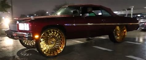 King Of Bling 1975 Chevy Caprice Donk Poses On 30 Inch Wheels At