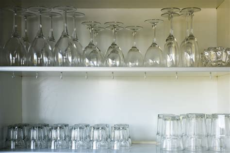 Clean Glassware Neatly Arranged On Open Shelves Free Stock Image